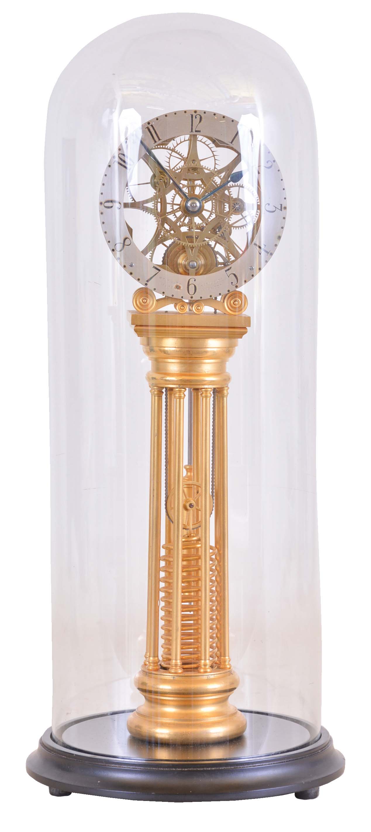 William Smith, Musselburgh, [Scotland] skeleton clock with helical mainspring, gilt, column form base supporting the skillfully pierced and finished 8 day fusee timepiece movement, and containing the mainspring, silvered dial marked "Wm. Smith Musselburgh Maker &amp; Inventor", blued steel hands, brass and steel pendulum, with dome and base — Antique Clocks Price Guide