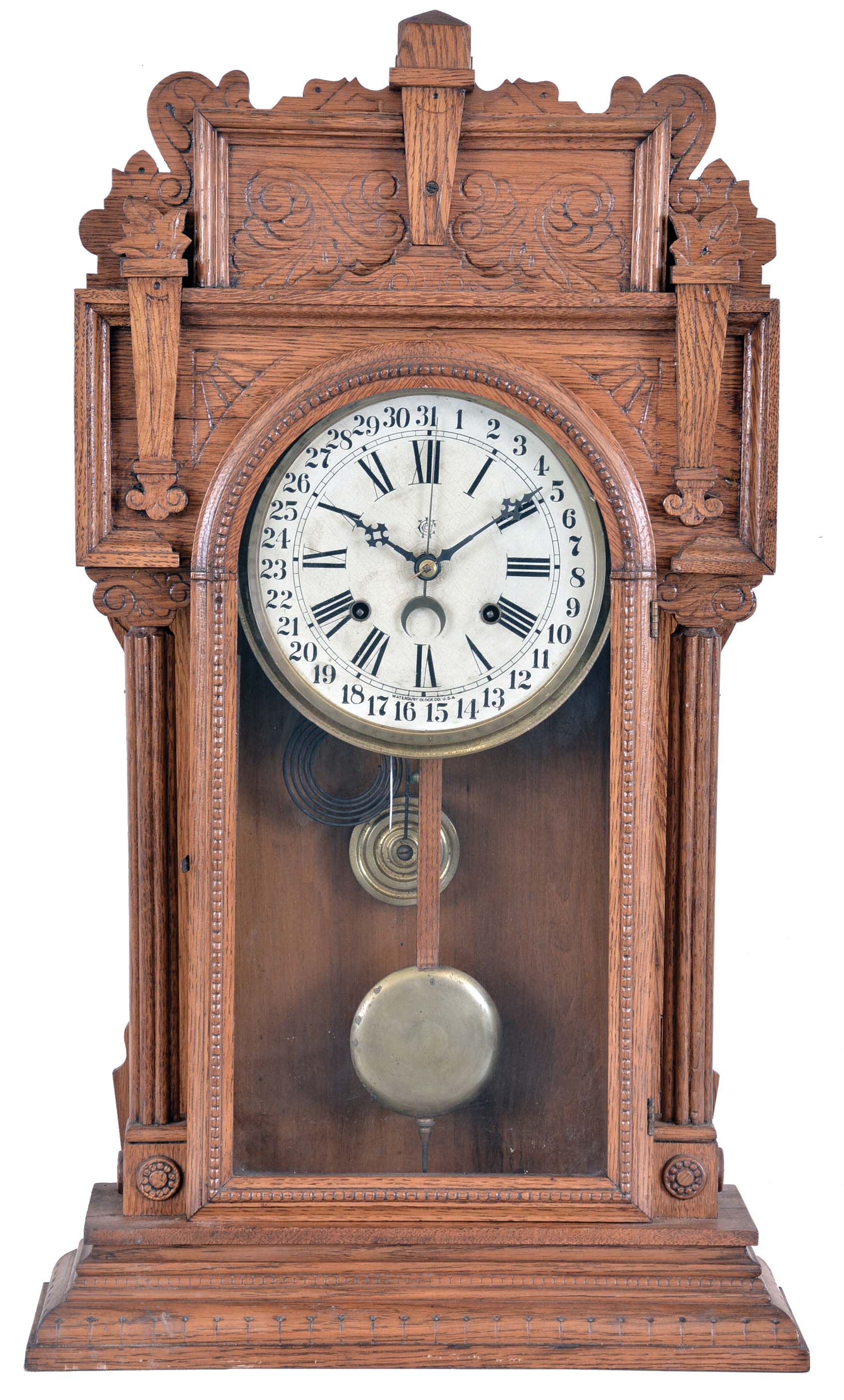Waterbury Clock Co., Waterbury, Conn., "Niagra" shelf clock with a spring driven 8 day time and strike movement with a simple calendar mechanism in an oak case. — Antique Clocks Price Guide