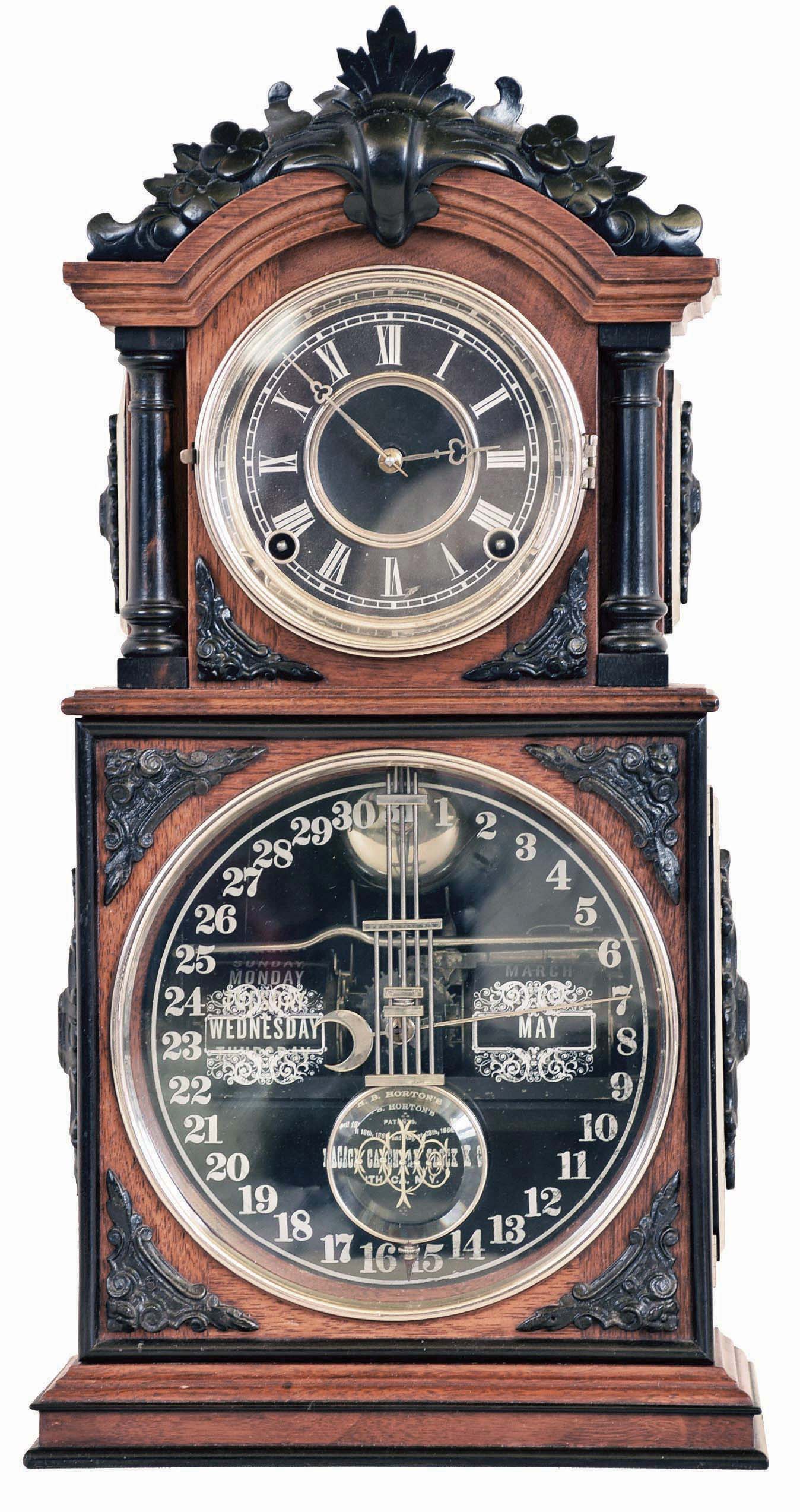 Ithaca Calendar Clock Co., Ithaca, NY, "3 1/2 Parlor" shelf clock with an 8 day time and strike spring driven brass movement and perpetual calendar mechanism in a walnut case with ebony trimmings. — Antique Clocks Price Guide
