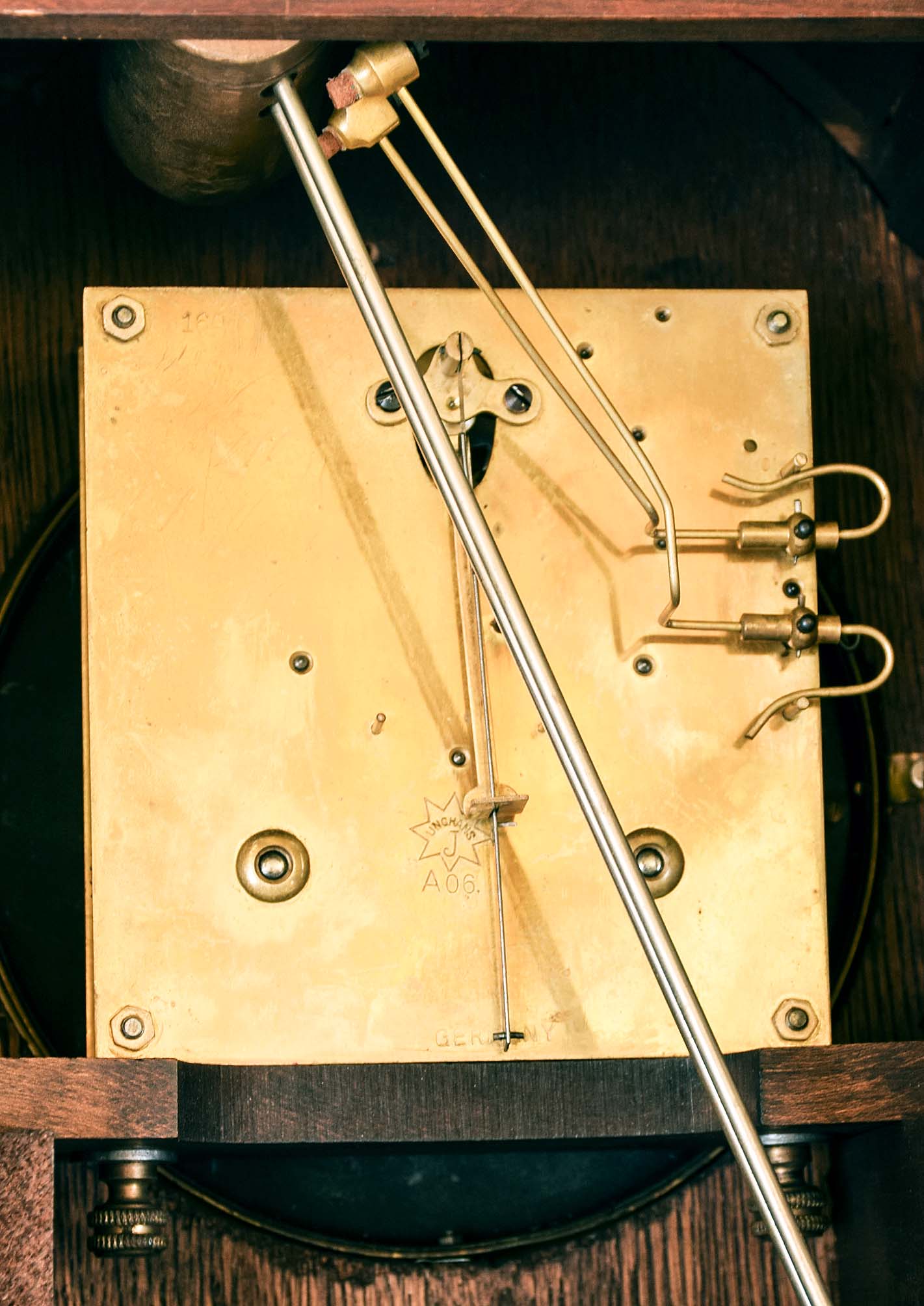 Clocks- 2 (Two): (1) Hamilton Clock Co., 8 day, time and strike Westminster chime spring brass movement bracket clock, c1978 (2) Germany, Junghans, 8 day, time and strike spring brass movement mantel clock, c. 1915. — Antique Clocks Price Guide