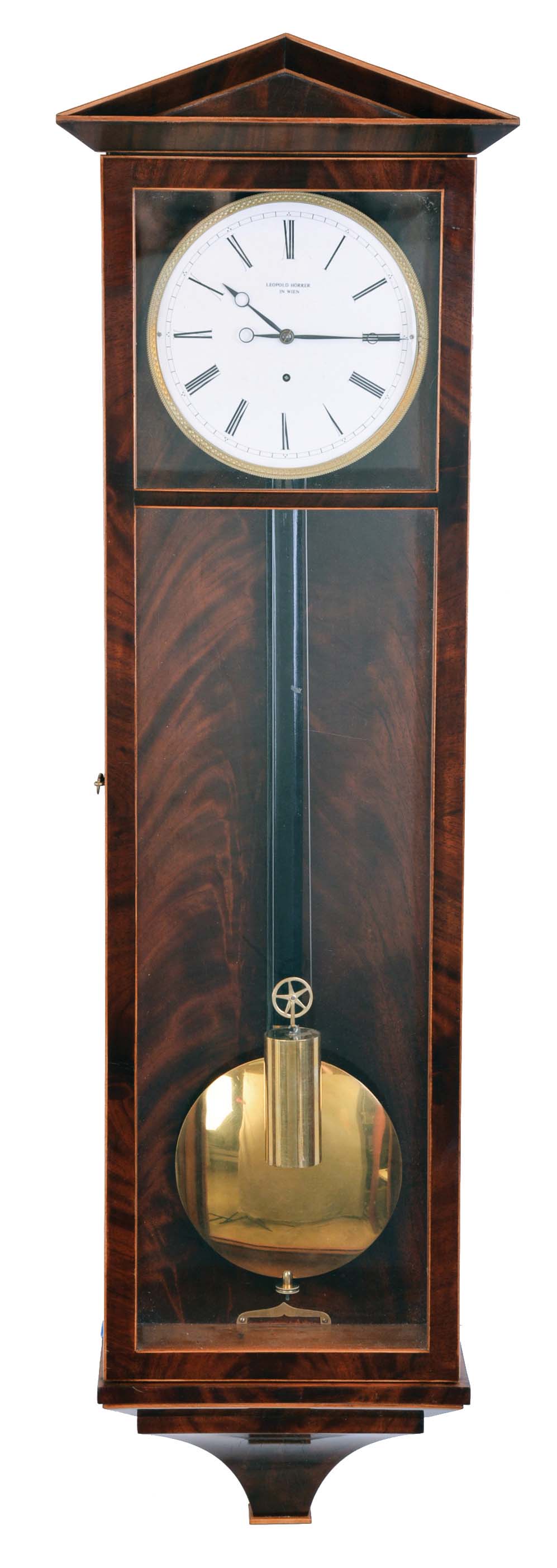 Leopold Horrer in Wien, Dachluhr, six light, mahogany veneered case with contrasting banding, base with incurved bracket, top with pitched pediment and beveled moldings, Roman numeral, one piece white enamel dial with engine turned, gilt bezel, blued steel hands, 8 day timepiece movement with tapered plates, baluster form pillars, and deadbeat escapement, brass pendulum with ebonized wooden rod, and brass weight — Antique Clocks Price Guide