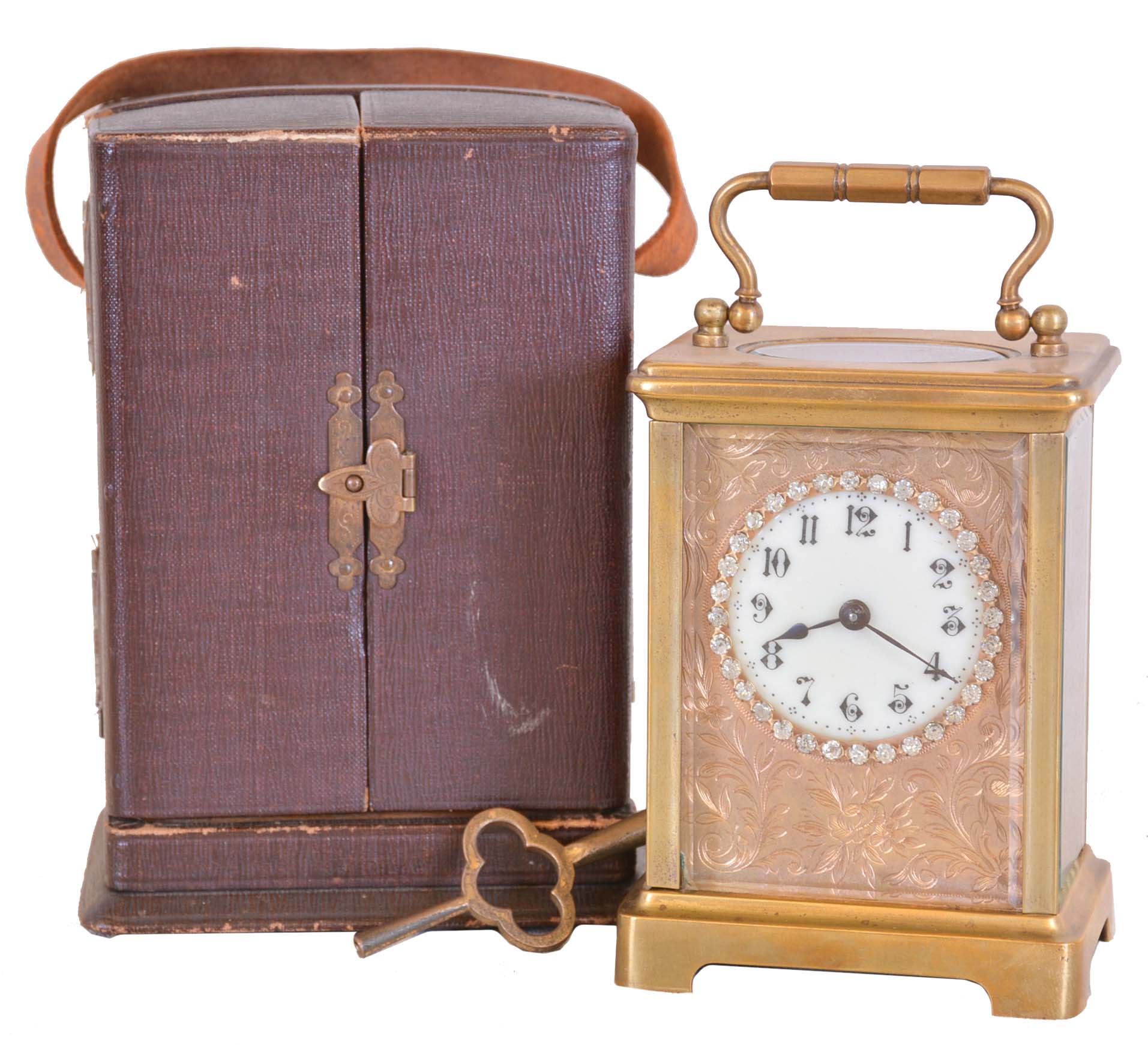 France, carriage clock, brass Corniche case with beveled glasses, Arabic numeral white enamel dial with engraved mask and brilliant set surround, 8 day timepiece movement with lever platform, and leather covered travel case — Antique Clocks Price Guide
