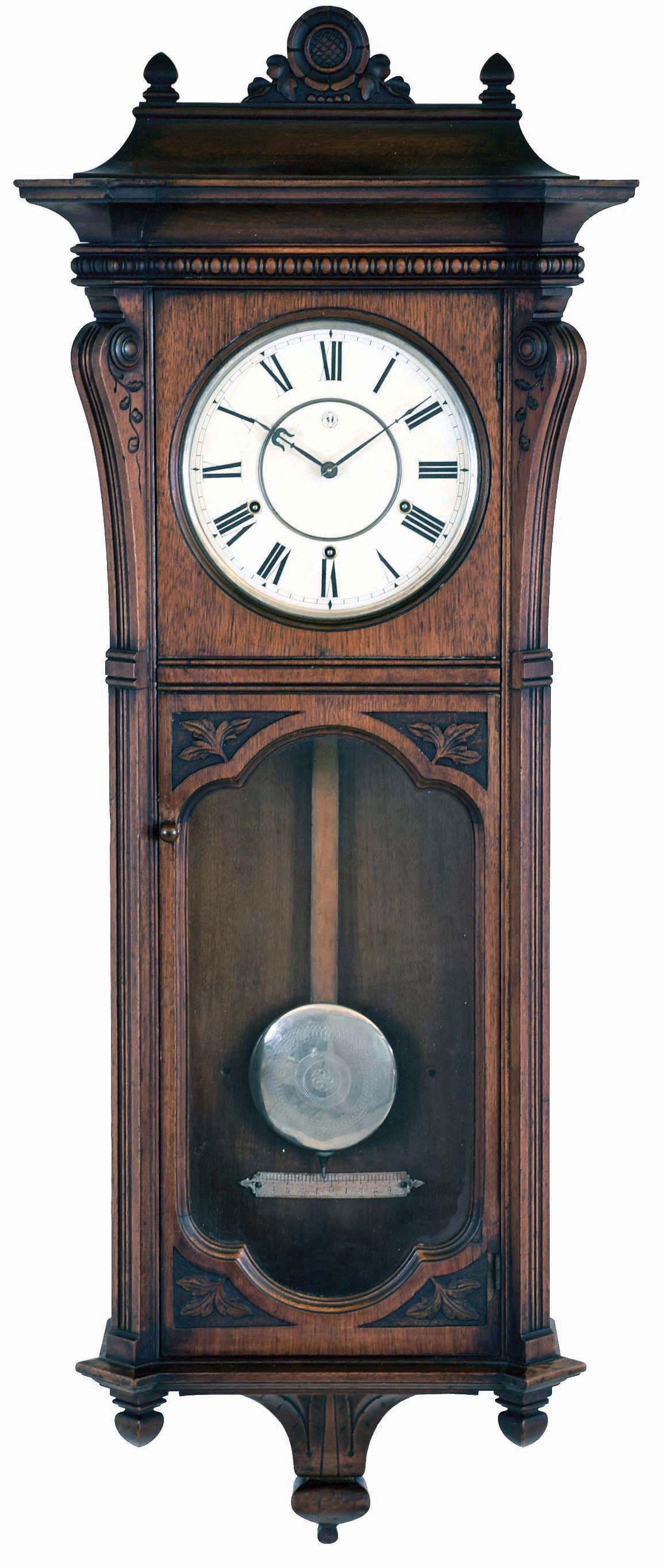 Seth Thomas Clock Co., Thomaston, Conn., "Marcy" wall hanging clock with a 8 days, 3- train, spring driven, time and strike, movement with cathedral gong strike on hour and quarter hour striking on 2 cup bells in a walnut case, — Antique Clocks Price Guide