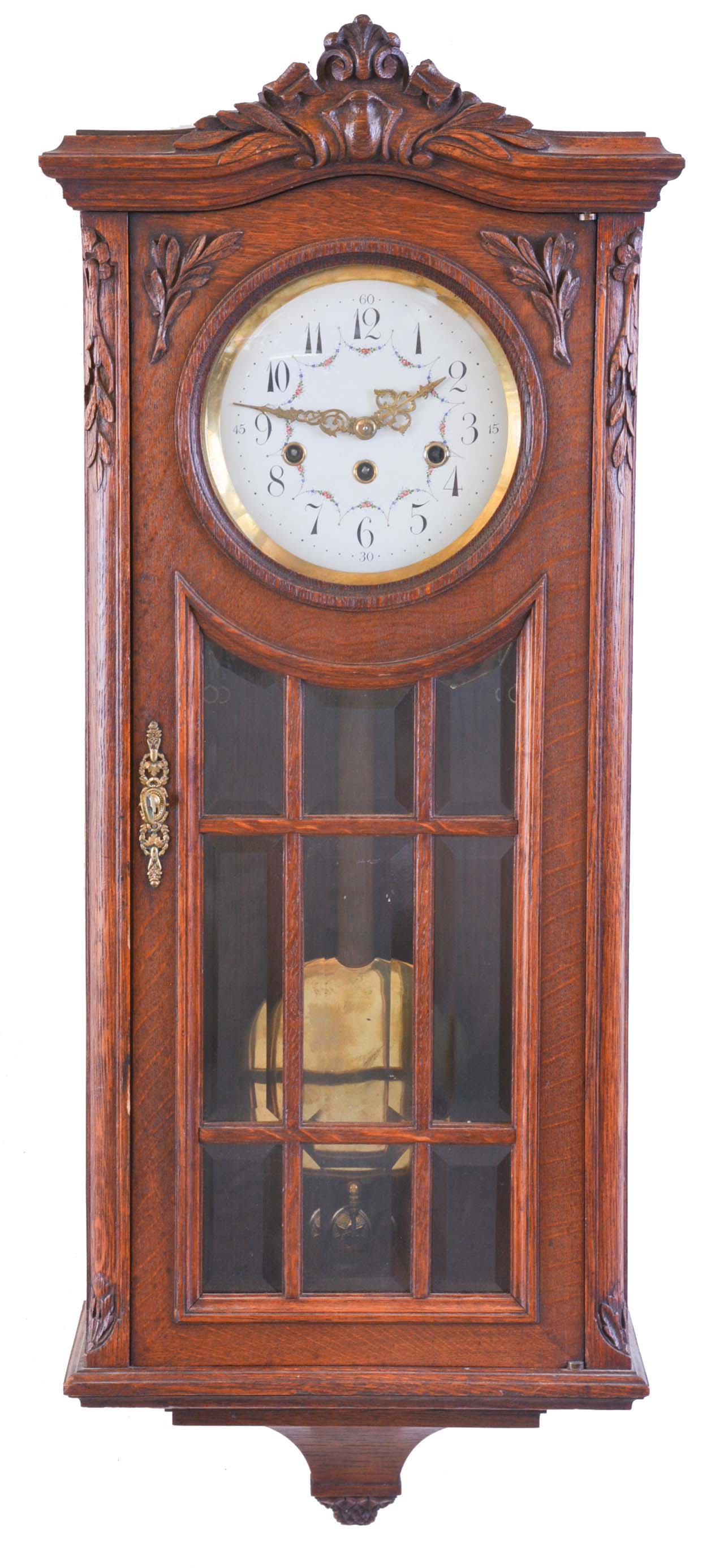 Junghans, Germany, a Westminster chiming wall clock, rectilinear oak case with carved ornament, door with 9 beveled glasses, Arabic numeral enamel dial with floral garlands and Louis XV style hands, 8 day, three train movement, with brass pendulum — Antique Clocks Price Guide