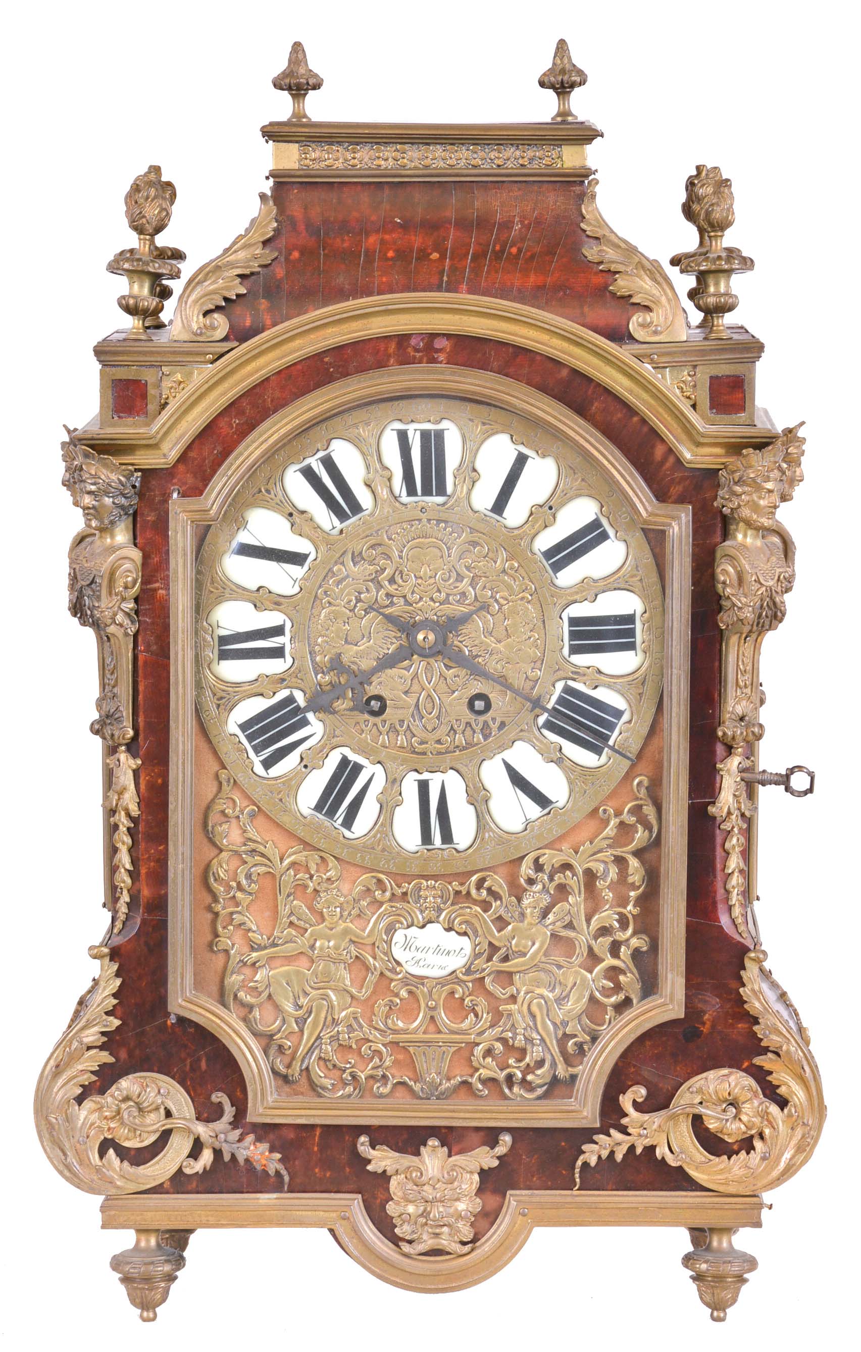 France, a 19th century Religieuse style mantel clock, the case with tortoise shell veneers, brass moldings and cast foliate ornament, corners mounted with half Atlantes figures, and the top with gadrooned flame finials, velvet lined dial with repousse style brass dial set with Roman numeral enamel cartouches, and with foliate mask below, with cartouche signed "Martinot a Paris", 8 day, time and strike movement with square plates — Antique Clocks Price Guide