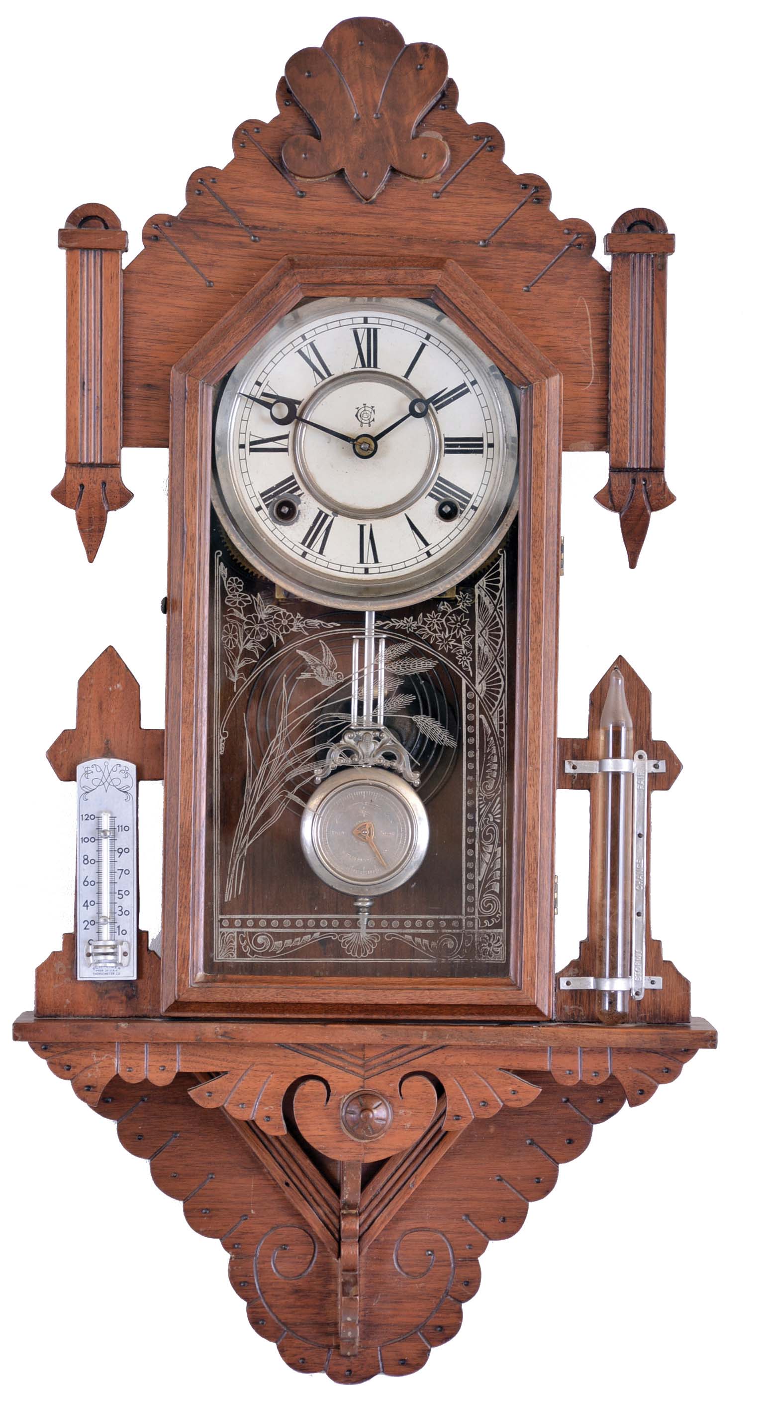 Waterbury Clock Co., Waterbury, Conn., "Union" wall hanging clock with a spring driven 8 day time and half hour strike movement in a walnut case with a thermometer and a storm glass. — Antique Clocks Price Guide