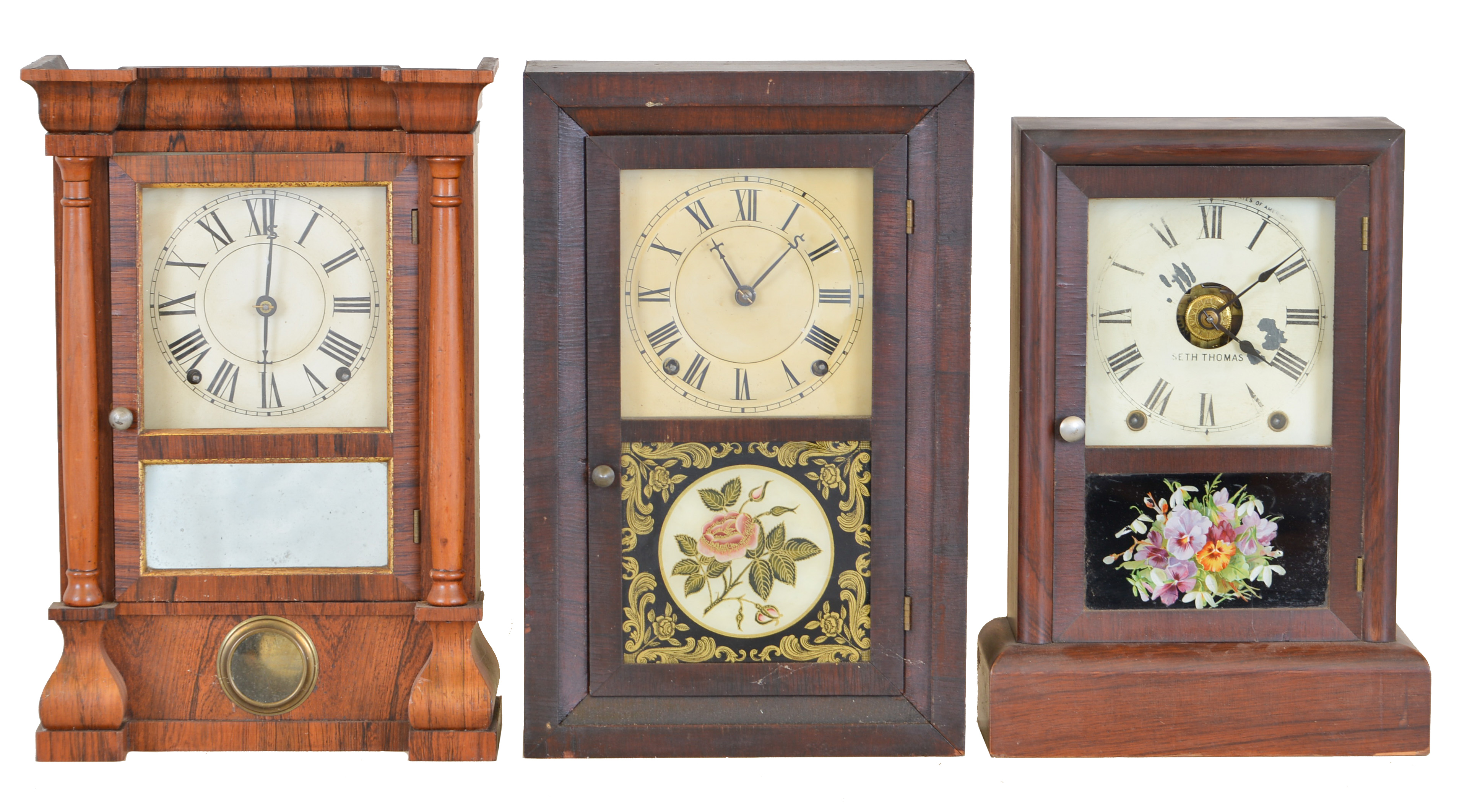 Clocks- 3 (Three): (1) Seth Thomas Clock Co., Thomaston, Conn., "Column" shelf clock with a spring driven 8 day time and strike lyre movement in a rosewood veneered case., c1885. (2) Seth Thomas Clock Co., Thomaston, Conn, "Kitchen" shelf clock with an 8 day spring driven time and strike lyre movement in a rosewood veneered case, c1880. (3) Seth Thomas Clock Co., Thomaston, Conn. shelf clock with a spring driven 8 day time, strike and alarm movement in a rosewood case, c1910. — Antique Clocks Price Guide