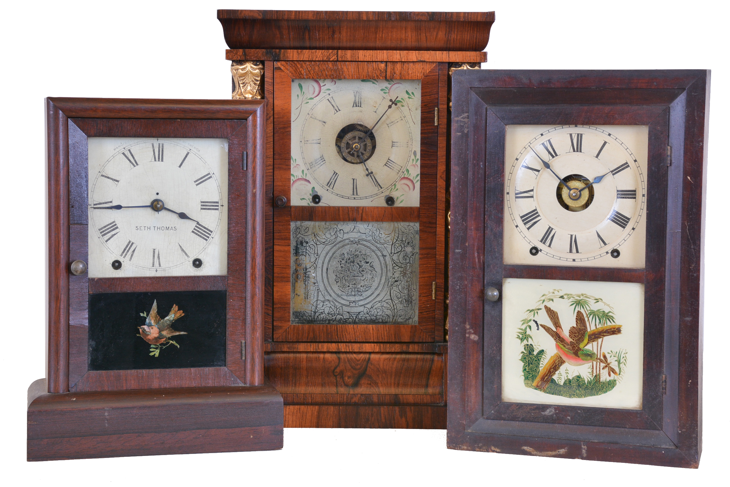 Clocks- 3 (Three): (1) Chauncey Jerome, New Haven, Conn. empire shelf clock with a spring driven 8 day time, strike and alarm movement in a rosewood veneered case with decorative gilt half columns, c1850. (2) Seth Thomas Clock Co., Thomaston, Conn., Cottage shelf clock with a spring driven 8 day time and strike movement in a rosewood veneered case, c1900. (3) Seth Thomas Clock Co., Thomaston, Conn. "Kitchen" shelf clock with a spring driven 8 day time, strike and alarm movement in a rosewood case, c1890. — Antique Clocks Price Guide