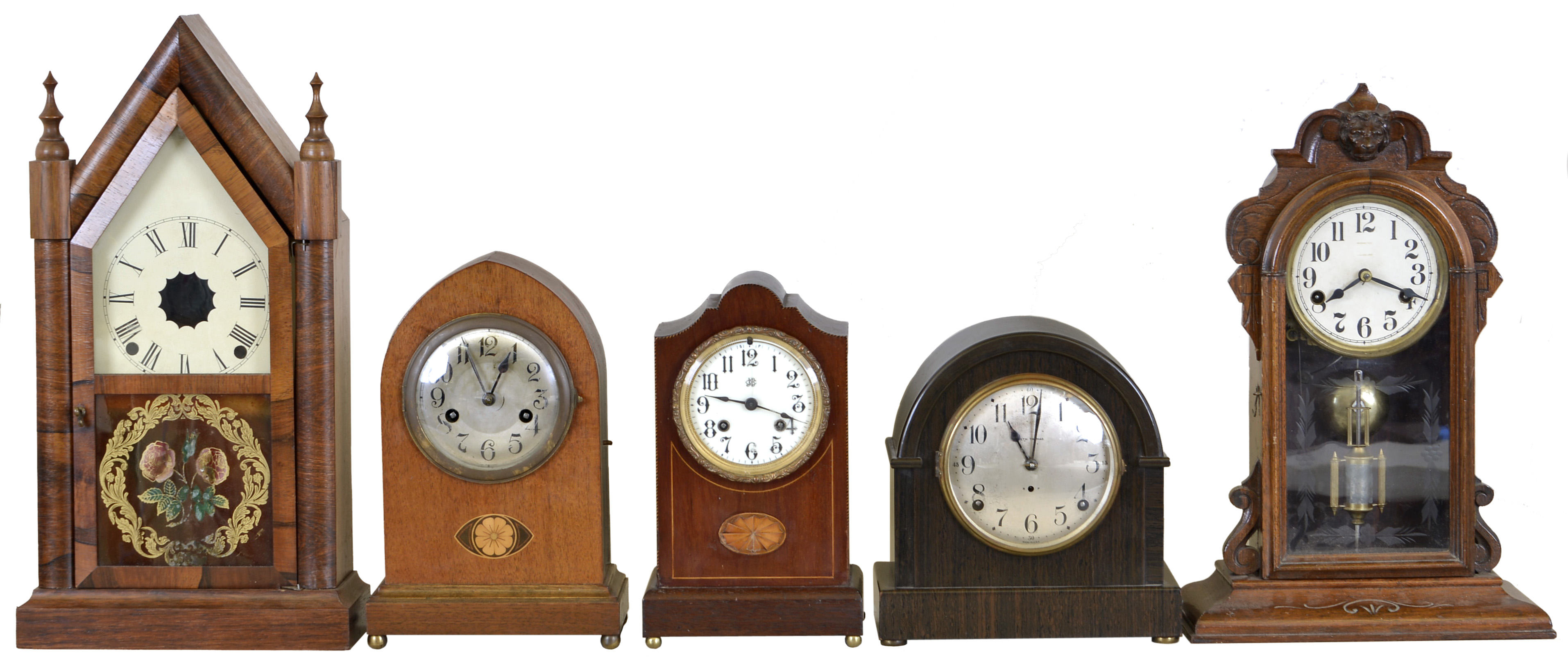 Clocks- 5 (Five): (1) German shelf clock with a spring driven 8 day time and strike movement in a walnut case with inlay, c1910. (2) Unmarked shelf clock with a spring driven 30 hour time and strike movement in a walnut case, c1900. (3) E. N. Welch Mfg. Co., Forestville, Conn. Steeple Clock (case only). (4) Vermont Clock Co., Fairhaven, VT, shelf clock with a spring driven 8 day time and strike movement with a balance wheel escapement in a mahogany veneered case with inlay, c1910. (5) Seth Thomas Clock Co., Thomaston, Conn, "Rival" shelf clock with a spring driven 8 day time and half hour strike movement in an adamantine case, c1920. — Antique Clocks Price Guide