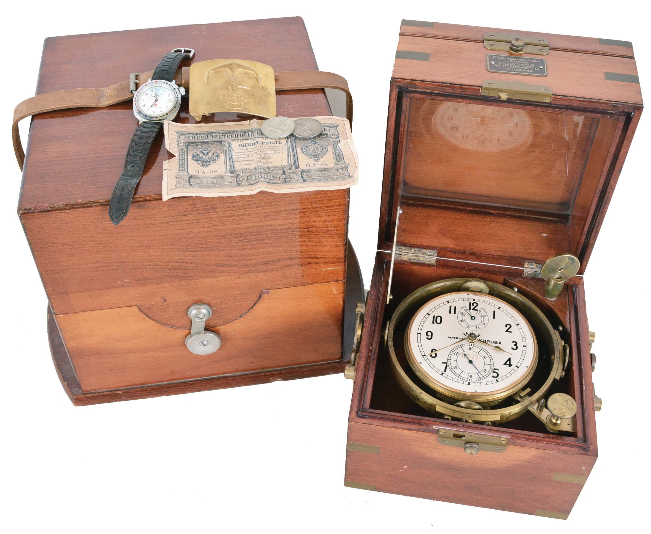 First Moscow Watch Factory, USSR, two day marine chronometer, 15 jewel, damascened, gilt movement with fusee, break circuit mechanism, and integral balance with helical hairspring, Arabic numeral silvered dial with gilt spade and poker hands, mounted in a gimbaled bowl and contained in a brass mounted mahogany box, and with outer, lined protective mahogany box, serial #11577, together with a Soviet era boxed wristwatch, and more, 20th century — Antique Clocks Price Guide