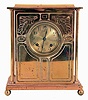 Ansonia Clock Co., New York, NY, "Sussex" mantel clock with a spring driven 8 days time & half hour strike movement in a brass plated case with four free standing columns.