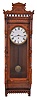 George B. Owen, Winsted, Conn., wall clock, 8 day, time only, spring driven movement in a walnut case with arcaded top and papered metal dial