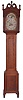 Pennsylvania, tall clock, 8 day, time and strike, weight driven movement in a cherry case with broken arch set with carved rosettes, carved plinths with three wooden finials, slender turned columns, sunburst carving at top of trunk door and reeded corner columns on trunk resting on a base with beaded center panel and turned front feet and rear bracket feet. The unsigned painted metal dial is attributed to William Jones of Philadelphia and includes moon phase with ship flying American flag.