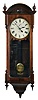 Seth Thomas Clock Co., Thomaston, Conn., "Regulator No. 6-Reissue" wall hanging clock with a weight driven 8 day timepiece movement in a walnut case.. The Regulator No. 6 was reissued by the Seth Thomas Clock Co in 1975. This particular one no longer has the label that indicates the serial number within the span of reissues.
