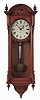 Seth Thomas Clock Co., Thomaston, Conn., "Regulator No. 6" with a weight driven 8 day timepiece movement in an oak case