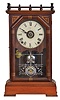 Clocks- 2 (Two) (1) Seth Thomas Clock Co., Thomaston, Conn., "Omaha" shelf clock with an 8 day spring driven time, strike and alarm lyre movement in a cherry case, c1885. (2) Seth Thomas Clock Co., Thomaston, Conn. "Cordova" shelf clock with a 15 day spring driven time & strike movement in a mahogany case, c1900.