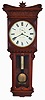 Seth Thomas Clock Co., Thomaston, Conn., "Regulator No. 7" hanging clock with an 8 day weight driven timepiece movement in a cherry case.