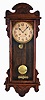Waterbury Clock Co., Waterbury, Conn., "Nassau", 8 day, time and strike spring brass movement wall clock.