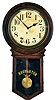 Clocks- 2 (Two): (1) Ingraham Clock Co., Bristol, Conn., "Postal" hanging wall clock with a spring driven 8 day movement in a solid oak case, c1911. (2) Ansonia Clock Co., New York, "Regulator A" wall hanging clock with an 8 day spring driven timepiece movement in an ash case, c1906.