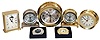 Clocks- 7 (Seven) Chelsea Clock Company metal case quartz movement clocks, new / old stock mostly in original factory packaging: two #20990 Brewster desk clocks in brass and nickel; #20892 "Moonphase in Brass" carriage clock with moon dial; #90886 Constitution Nickel, #20886 Constitution (brass) ; #40069 (?) Newport; #40095 (?) "Timemaster"