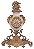 France, mantel clock, the vase form porcelain case with painted putti flanking the dial, satyr mask handles, the top with flowers and a pair of birds, all on a gilt base with foliate ornament, porcelain dial with Roman numerals, gilding, and central polychrome putto, gilt hands, and 8 day time and strike pendule de Paris movement