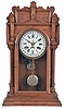 Waterbury Clock Co., Waterbury, Conn., "Niagra" shelf clock with a spring driven 8 day time and strike movement with a simple calendar mechanism in an oak case.