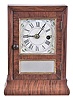 Seth Thomas Clock Co., Plymouth Hollow, Conn., 30 hour, spring brass movement cottage timepiece. This looks to be a prototype or one of the earliest examples as the movement has a brass spring and flower spandrels on the dial.