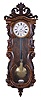 Austria, hanging regulator, walnut case with carved, serpentine front, carved crest, and grain painting, Roman numeral, two piece enamel dial, blued steel hands, 8 day timepiece movement, brass pendulum with wooden rod, and brass weight