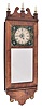 Michael Paul, Berea, Ohio, 30 hour, weight brass movement with weight alarm miniature timepiece copy of a New Hampshire mirror clock. This example is number 9 of 15.