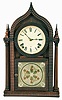 E. N. Welch, Forestville, Conn., "Oriental Gothic 4 Column" shelf clock with a spring driven 8 day time & strike brass movement in a ripple front rosewood case with mahogany columns.