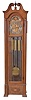 Herscede Hall Clock Co., Cincinnati, Ohio, "Patent No. 121" variant tall clock, 8 day, time, strike and Westminster chime on 5 tubular bells in a hard wood case with antique French finish, broken arch top and glass sides. The brass dial has silvered chapter ring, moon phase, raised numerals, cut brass spandrels and dial center and second's bit.