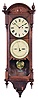 Seth Thomas Clock Co., Thomaston, Conn., "Office Calendar No. 10" wall hanging clock with a weight driven timepiece movement and an R. T. Andrews 1876 patent perpetual calendar in an oak case