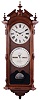 Ithaca Calendar Clock Co., Ithaca, NY, "No. 2 Bank" wall hanging clock with a weight driven 8 day timepiece movement and perpetual calendar mechanism in a walnut case.