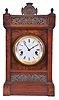 Seth Thomas Clock Co., Thomaston, Conn., "Austin", city series mantel clock in walnut, with Roman numeral white enamel dial, and 8 day time and strike movement