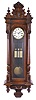 Austria, grand sonnerie striking regulator, beech and walnut case, door with fluted and carved columns, molded top with removable crest, and base with veneered bracket and turned drops, Roman numeral, two piece white enamel dial, blued steel hands, 8 day, three train, quarter striking movement, brass pendulum with wooden rod, and brass weights