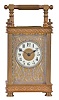 France, carriage clock, rectilinear gilt brass case, with pierced fret trimmed base and frieze, silvered, pierced and engraved dial mask, Arabic numeral white enamel dial, blued steel spade hands, 8 day timepiece movement with lever platform