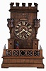 Germany, shelf cuckoo with sentry automata, carved wooden architectural case of Gothic design, molded base with pierced railing enclosing the structure; the building with guard shelters, turrets, and crenellated parapet, and Turkish guard marching back and forth between the shelters as the clock runs, Roman numeral wooden dial, pierced bone hands, 30 hour brass time and strike movement, with carved, painted cuckoo