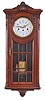 Junghans, Germany, a Westminster chiming wall clock, rectilinear oak case with carved ornament, door with 9 beveled glasses, Arabic numeral enamel dial with floral garlands and Louis XV style hands, 8 day, three train movement, with brass pendulum