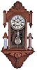 Waterbury Clock Co., Waterbury, Conn., "Union" wall hanging clock with a spring driven 8 day time and half hour strike movement in a walnut case with a thermometer and a storm glass.