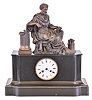 France, a black slate mantel clock, polished black case with gilt trimmed base molding, the top with bronze figure of Aristotle, seated in a klismos chair and in a contemplative pose, with attenuated column to his right, and a parcel of scrolls at his left, Roman numeral white enamel dial, blued steel Breguet style hands, and 8 day, time and strike pendule de Paris movement, marked Rollin a Paris