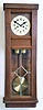 Clocks- 2 (Two) 8 day wood case wall clocks: Gustav Becker time and strike weight driven movement in later simple case with modern dial; American Clock Company, Chicago, self- winding wall clock