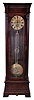Standing regulator, polished mahogany and mahogany veneer case, Roman numeral brass dial with aperture below the center arbor for viewing the escapement eight day weight driven movement with high count, five wheel train, crutchless Graham deadbeat escapement, and beveled glass dust shields, heavy, bi metallic pendulum with 12", stone inlaid lenticular ball and the pallets rigidly attached at top of rod, integral suspension with beat adjustment, disc shaped weight also with stone inlay