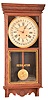 Clocks- 2 (Two): (1) Sessions Clock Co., Forestville, Conn., "Crescent No. 15" wall hanging clock with an 8 day spring driven brass timepiece movement with a simple calendar mechanism in an oak case, c1915 (2) Sessions Clock Co., Forestville, Conn., "Regulator E" wall hanging clock with an 8 day spring driven time and strike movement with a simple calendar mechanism c1908.