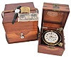 First Moscow Watch Factory, USSR, two day marine chronometer, 15 jewel, damascened, gilt movement with fusee, break circuit mechanism, and integral balance with helical hairspring, Arabic numeral silvered dial with gilt spade and poker hands, mounted in a gimbaled bowl and contained in a brass mounted mahogany box, and with outer, lined protective mahogany box, serial #11577, together with a Soviet era boxed wristwatch, and more, 20th century