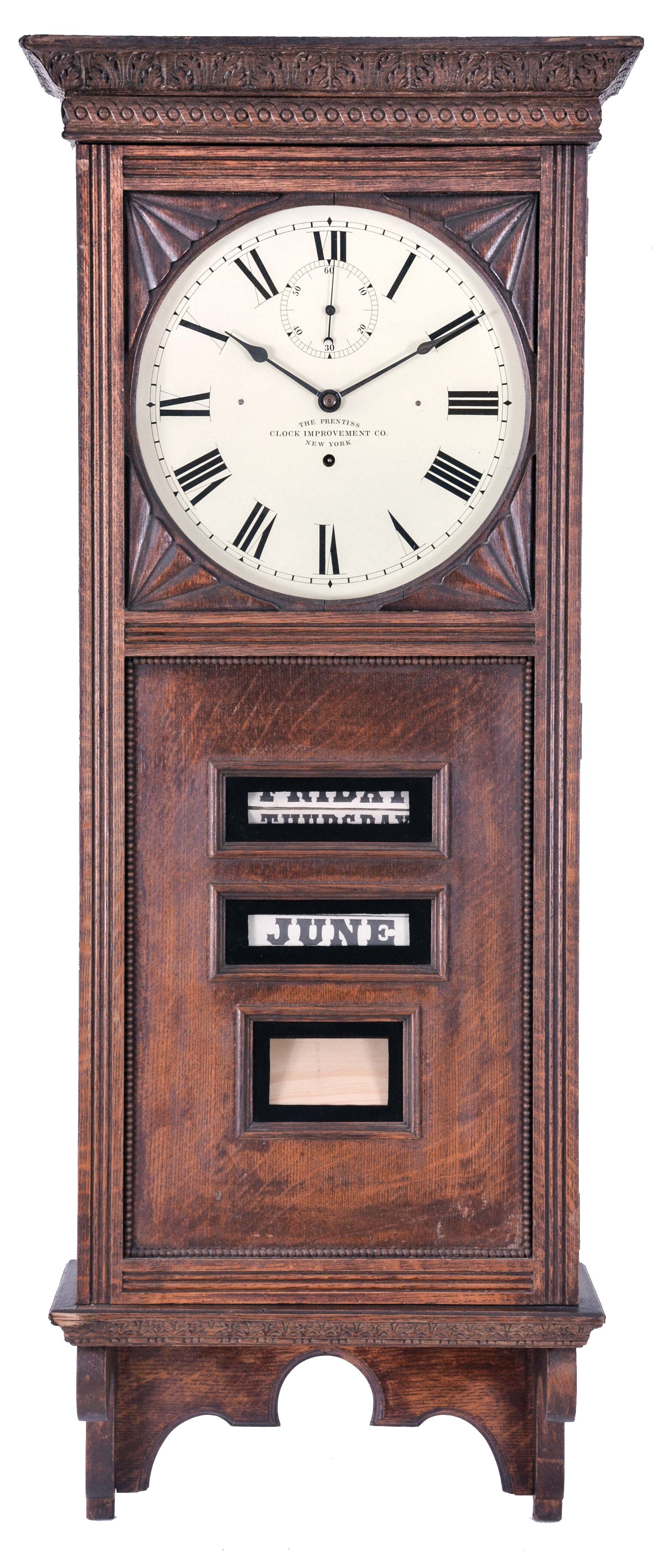 The Prentiss Improvement Clock Co., 49 Dey Street, New York, New York "Standard" wall clock with an 60 day time only movement with a seconds bit and a Prentiss patented calendar mechanism in an oak case. — Antique Clocks Price Guide