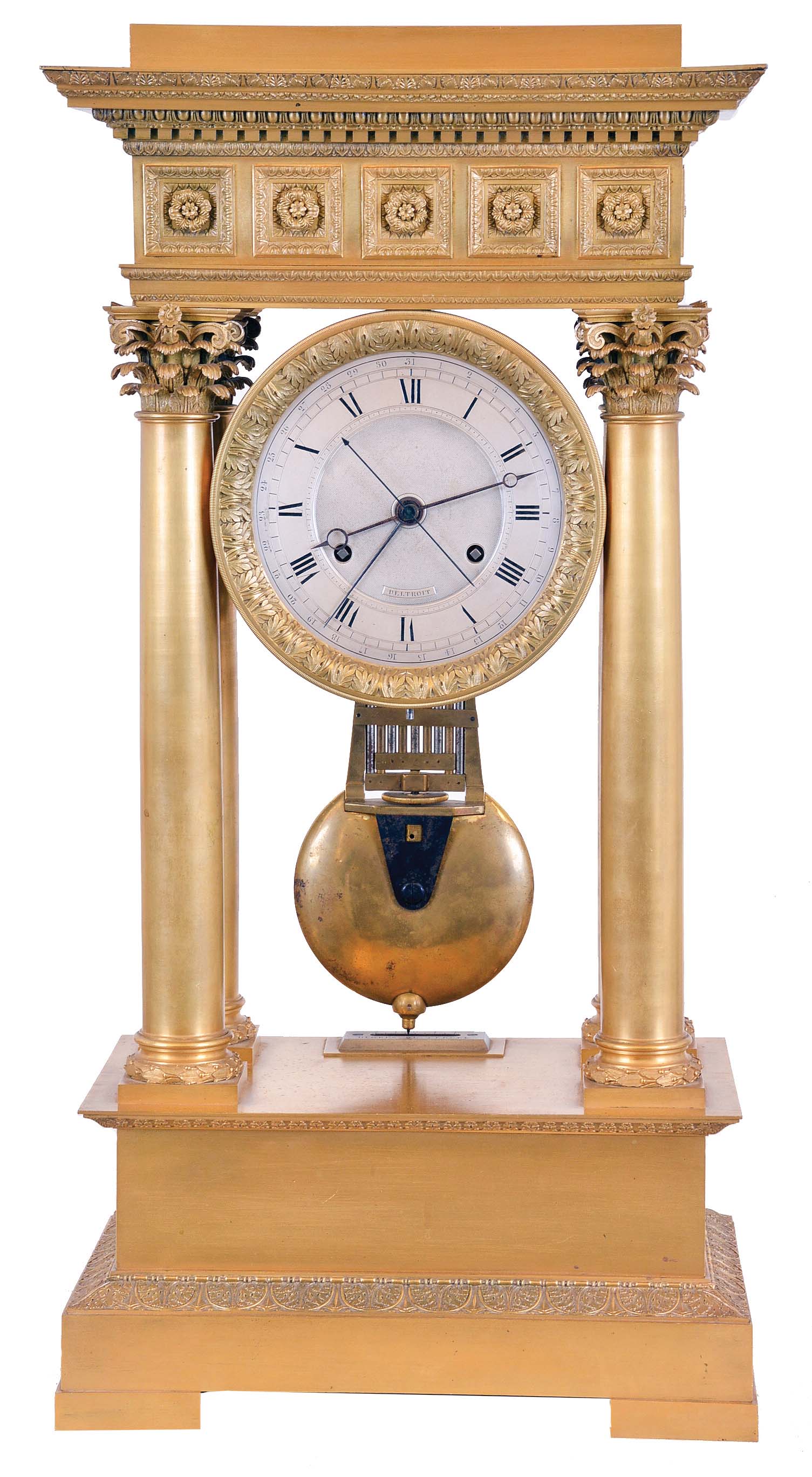 Deltroit, Paris, a large, Charles X mantel regulator, gilt bronze portico style case with acanthus and waterleaf decorated base molding, columns with laurel wreathed bases, multi part Corinthian capitals, and supporting an ornate entablature, the architrave with stepped fascia and leaf and dart moldings, coffered frieze also with leaf and dart moldings and central rosettes, and the cornice with leaf and dart, dental, egg and dart, and anthemion decorated moldings, gilt bezel with acanthus ornament, Roman numeral silver dial with inner seconds chapter, and perimeter date display, blued steel hands, 8 - 15 day brass movement with pin wheel escapement, the back plate signed in script "Deltroit Eleve de Janvier", heavy gridiron pendulum with knife edge suspension, silvered beat scale, dial and movement signed — Antique Clocks Price Guide