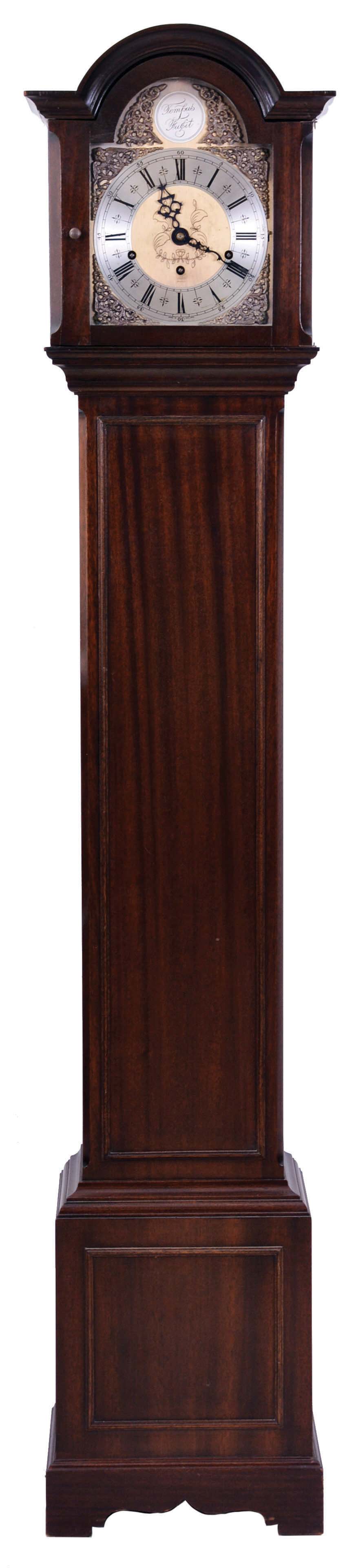 F.W. Elliot Ltd., Croydon, England, dwarf tall clock, 8 day, time, strike and chime playing Whittington and Westminster tunes, spring driven movement with balance wheel in a mahogany case with brass dial and silvered chapter ring, serial #15457 — Antique Clocks Price Guide