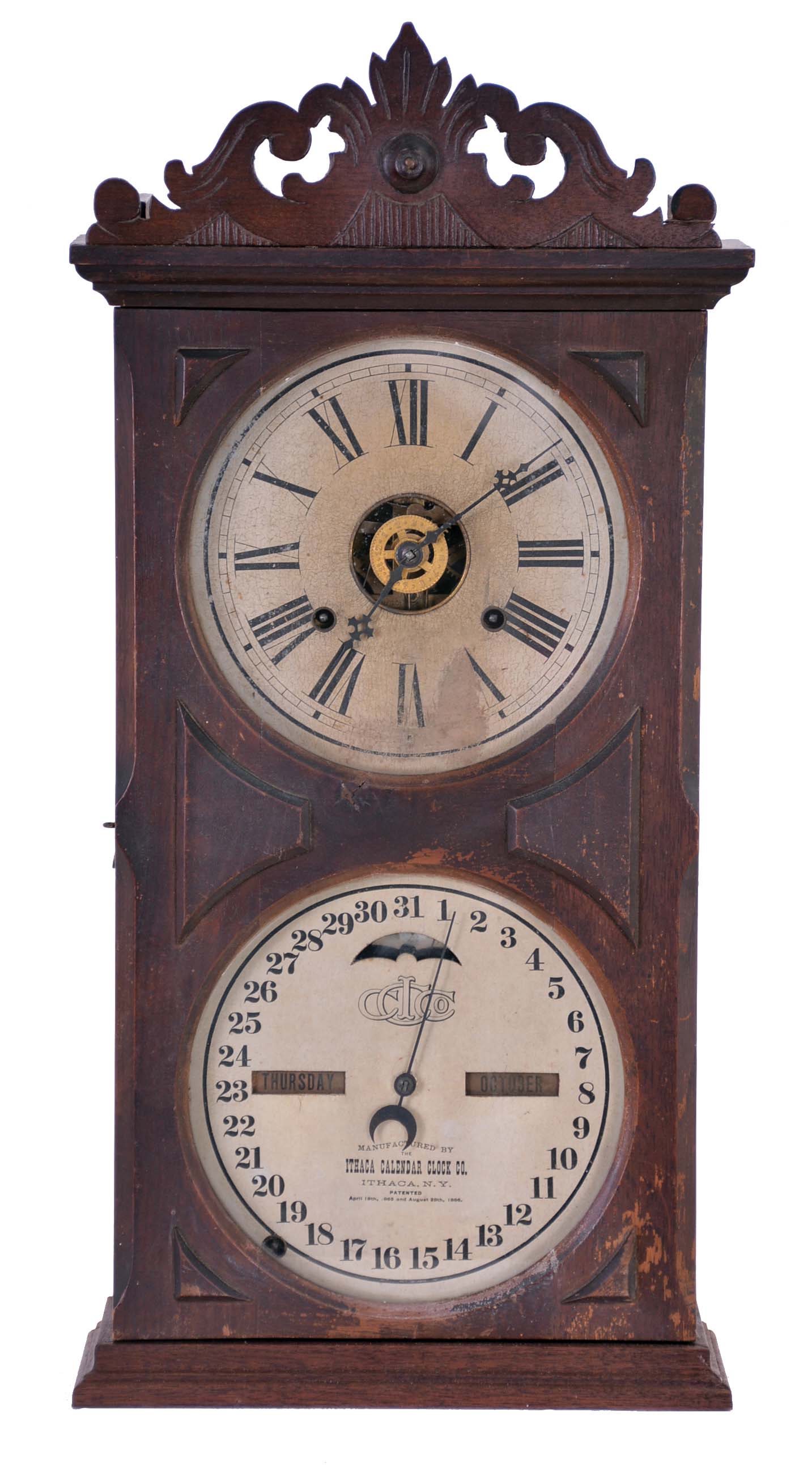 Ithaca Calendar Clock Co., Ithaca, NY, "No. 10 Farmer's" shelf clock with a spring driven, 8 day time, strike and alarm movement with a Horton's perpetual calendar mechanism in a walnut case. — Antique Clocks Price Guide