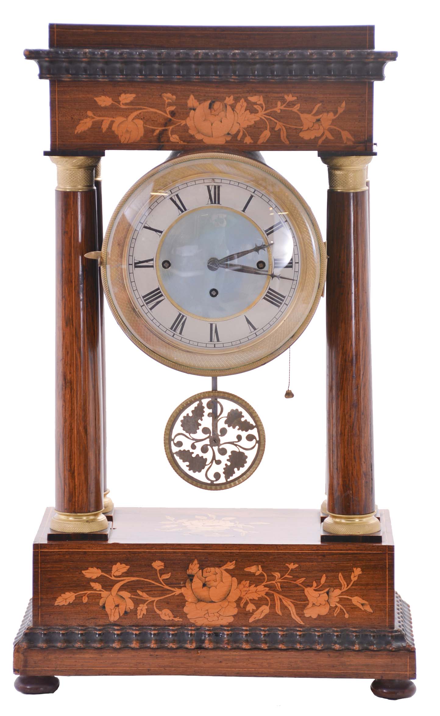 Austria, a mid 19th century portico clock with grand sonnerie striking, the case with rosewood veneers, ripple moldings, and contrasting, foliate marquetry, the columns with cast capitals and bases, Roman numeral silvered dial, blued steel hands, two day brass movement sounding the quarters in passing, and repeating the last hour and quarter on demand, silk suspended pendulum with engine turned rim, and decorative, pierced center — Antique Clocks Price Guide