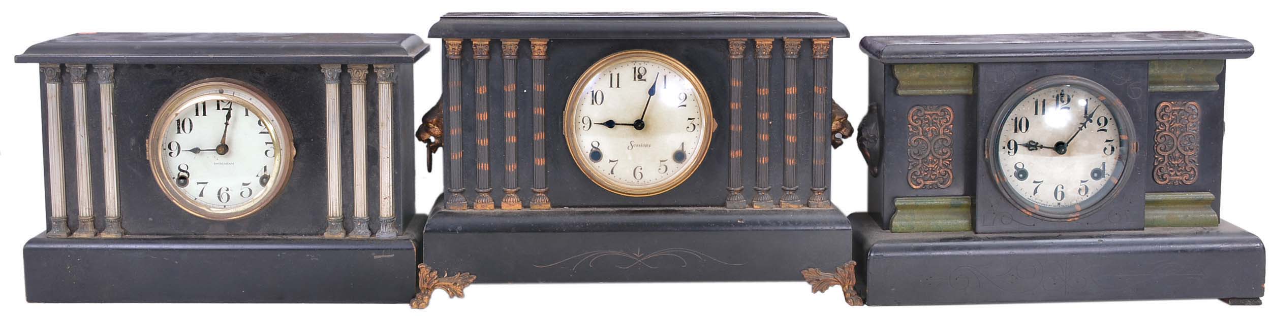 Clocks- 13 (thirteen) mantel clocks including 8 (eight) wood case, 1 (one) stone case, and 4 (Four) enameled iron cases. Makers include Sessions, Waterbury, Ingraham and Ansonia. The standout would be the Ansonia "Nubia" with the oversized wolf/lion side pieces and large paw feet. — Antique Clocks Price Guide